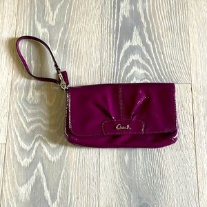 Plum coach wristlet